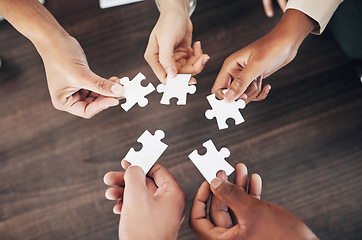 Image showing Business people, hands or puzzle for teamwork, solution problem solving with planning, synergy or collaboration. Jigsaw, growth or partnership support, project development or community group mission