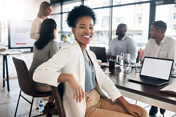 Image showing Portrait, meeting and a black woman in a business boardroom with her team for a strategy presentation on laptop mockup screen. Workshop, training and collaboration with a female sitting at a table