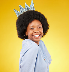 Image showing Portrait, queen smile and black woman with crown in studio isolated on a yellow background. Paper, royal tiara and happy, beauty and confident African female model or princess with royalty pride.