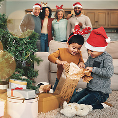 Image showing Christmas, excited and children opening gifts, looking at presents and boxes together. Smile, festive and kids ready to open a gift, or present under the tree for celebration of a holiday at home