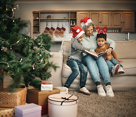 Image showing Christmas, photo album or children with a senior grandmother and kids looking at photographs during festive season. Family, love or celebration with a woman and grandchildren holding a picture book