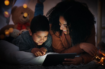 Image showing Movie, dark and a mother and child with a tablet before bedtime for a show, video or meme. Happy, streaming and a mom and boy kid watching a film, cartoon or series online with technology at night