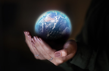 Image showing Woman, hands and earth on black background, sustainability in future conservation of environment. Climate change, global care and hope, protection for planet and safety or security for mother nature.