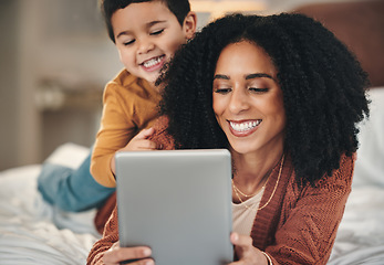 Image showing Tablet, mother and kid relax on bed, bonding and streaming movie, film or video online. Technology, care and smile of happy mama with touchscreen for learning development with boy or child in bedroom