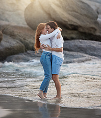 Image showing Love, hug and happy with couple at beach for romance, relax and vacation trip. Travel, sweet and cute relationship with man and woman holding in embrace on date for summer break, trust and bonding