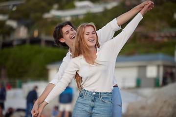 Image showing Flying, happy and laughing couple at the beach for a date, honeymoon and bonding in Bali. Smile, comic and playful man and woman with care, love and affection at the sea for happiness together