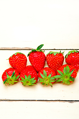 Image showing fresh organic strawberry over white wood