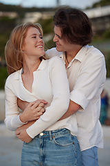 Image showing Couple hug on beach, happy and travel with love and commitment in relationship, adventure and romance. Trust, partnership and care with young people outdoor, tropical holiday and happiness on date