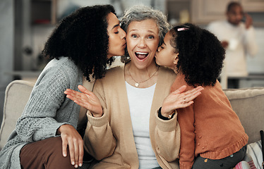 Image showing Portrait, surprise or love with a daughter and granddaughter kissing a senior woman on the cheek in a home. Mothers day, wow or children with a girl and mother giving a kiss to a grandmother