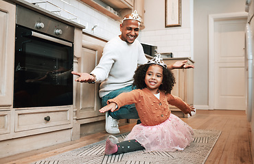 Image showing Child learning, ballet tutu and father in a kitchen excited about young girl dancing with flexibility. House, family and parent love in a home with a kid having fun with support in a household