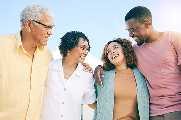 Image showing Happy family, couple and parents on vacation or holiday bonding together smile and having fun outdoors. People, man and woman embrace with mother and father as love, care and support during weekend