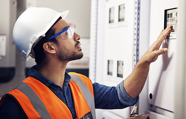 Image showing Man, switch box and technician in control room, mechanic inspection and machine maintenance. Male electrician, system and electrical substation for electricity, industrial generator and engineering