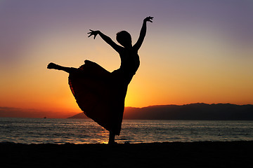 Image showing Dancing woman at sunset