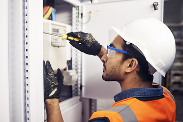 Image showing Man, electricity and screwdriver of maintenance box in control room, engineering or machine mechanic. Male electrician, screw tool and power installation of industrial generator, technician or repair