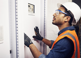 Image showing Man, system and technician in control room, power box inspection and machine maintenance. Male electrician check server, switch board and industrial generator in electrical substation for engineering