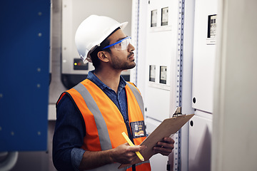 Image showing Man, engineering and clipboard in control room, box inspection and machine maintenance. Male electrician, system and electrical substation for power, industrial generator and technician checklist