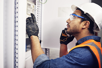 Image showing Man, phone call and engineering in control room, switchboard and power box inspection. Male electrician talking on smartphone at power box, server mechanic and electrical substation maintenance