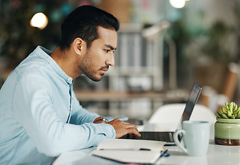 Image showing Business, focus and man with laptop, research and online reading in workplace, software update or website design. Male employee, consultant or worker with device, technology or typing with connection