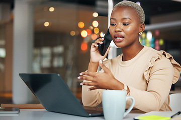 Image showing Phone call, business and black woman talking in office, chatting or speaking to contact. Laptop, cellphone and female professional in conversation, networking or discussion with smartphone at night.