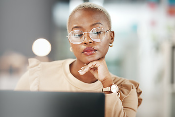 Image showing Office, laptop and black woman with glasses, thinking or reading email, online research or report. Computer, concentration and African journalist proofreading article for digital news website or blog