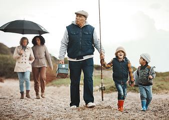 Image showing Family, fishing vacation and man, women and happy kids at ocean, weekend hobby and fun together. Grandparents, mom and excited children walking at beach or lake on winter holiday adventure in nature.