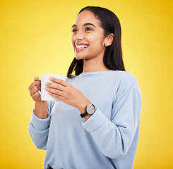 Image showing Morning, coffee mug and happy woman in a studio with a smile from espresso. Isolated, yellow background and smile of a young female with happiness and joy ready to start the day with confidence