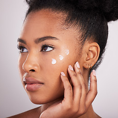 Image showing Skincare, beauty and black woman with cream on face for anti aging or fresh skin glow on white background. Cosmetics, facial and lotion, African model with moisturizer or cleansing product in studio.