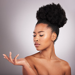 Image showing Beauty, skincare and hand of black woman with product placement for cosmetics on white background. Studio, mockup and makeup presentation, African model with glowing skin and spa or salon treatment.