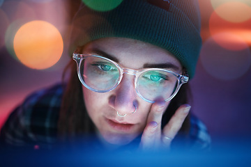 Image showing Coding, face and serious woman working overtime at night programming a computer, website or app development. Focus. workaholic and young female student or web design freelancer with a deadline