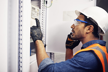 Image showing Man, phone call and engineering in control room, switchboard or industrial system inspection. Male electrician talking on smartphone at power box, server mechanic or electrical substation maintenance