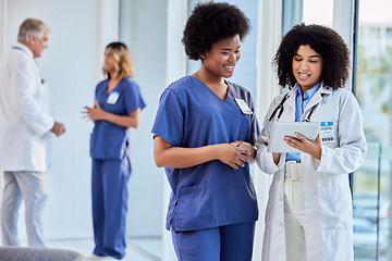 Image showing Tablet, healthcare or collaboration with a doctor and nurse talking in the hospital while doing research. Medical, teamwork and trust with professional colleagues in medicine working in a clinic