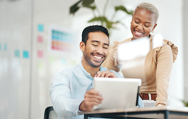 Image showing Creative business people, tablet and smile for planning, design or digital marketing at the office desk. Happy asian man and black woman smiling with touchscreen for project plan or startup strategy