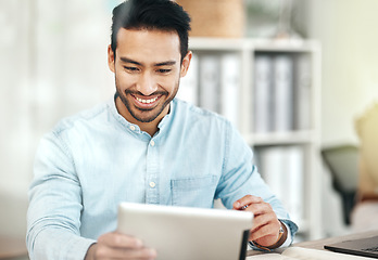 Image showing Creative asian man, tablet and smile for planning, design or social media at the office desk. Happy male employee smiling on touchscreen for business plan, strategy or online browsing at workplace