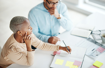 Image showing Collaboration, strategy overhead and a business black woman at work with a man colleague in an office. Teamwork, planning and documents with professional people brainstorm thinking while working