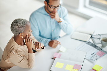 Image showing Collaboration, planning overhead and a business black woman at work with a man colleague in an office. Teamwork, strategy and documents with professional people brainstorm thinking while working