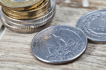 Image showing a stack of American twenty-five-cent coins, a close-up of American coins