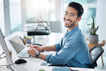 Image showing Happy business man, portrait and laptop in office for happiness, startup management and planning. Young male worker, smile and computer technology with motivation, online project and pride at desk