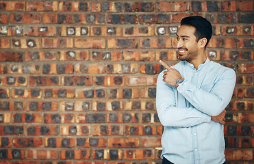 Image showing Pointing, mockup and smile with man and wall background for announcement, product placement and offer. Idea, news and deal with male and hand gesture with for information, empty space and opportunity