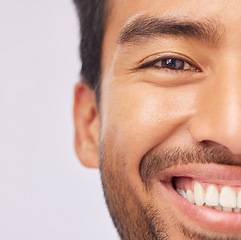 Image showing Half, face and teeth of a man with dental, oral and mouth hygiene isolated against a studio white background. Smile, clean and whitening treatment for a happy male feeling excited and confident