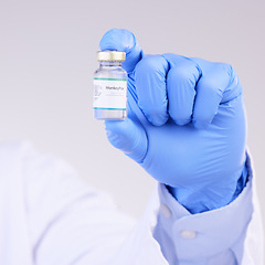 Image showing Vaccine, doctor hands and monkeypox bottle for safety, medicine and healthcare innovation in studio. Closeup vaccination, person and liquid vial for drugs, medical virus and pharmaceutical research