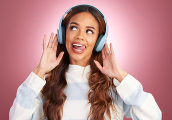 Image showing Mockup, tongue out and woman with headphones, streaming music and happy against a pink studio background. Headset, female and lady with joy, silly and listening to radio with audio, song and sounds