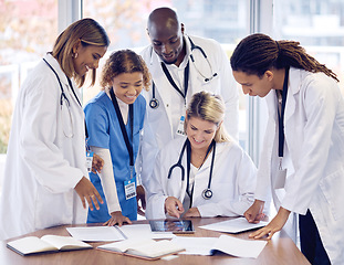 Image showing Doctors group discussion, tablet and desk with documents, results or report with teamwork, good news and support. Team, touchscreen and big data analysis for progress, development or medical research