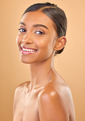 Image showing Smile, beauty and portrait skincare of a woman isolated on a studio background. Happy, beautiful and an Indian model with a glow from cosmetics, healthy skin and smooth complexion on a backdrop