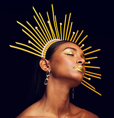 Image showing Crown, gold makeup and a beauty queen isolated on a black background in a studio. Dreaming. ethereal and an Indian girl with cosmetics, accessories and jewelry for royalty on a dark backdrop