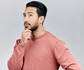 Image showing Confusion, ideas and Asian man thinking, opportunity and decision against a grey studio background. Japan, male and guy with wonder, thoughts and contemplation with doubt, unsure and uncertainty