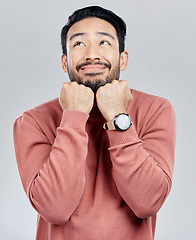 Image showing Happy, looking and a handsome Asian man thinking isolated on a white background in a studio. Cute, smile and a Chinese guy with an idea, adorable pose and dreaming on a backdrop with happiness