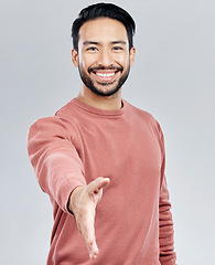 Image showing Asian man, portrait smile and handshake for meeting, deal or introduction isolated against white studio background. Happy male smiling and shaking hands for greeting, introduction or friendly gesture