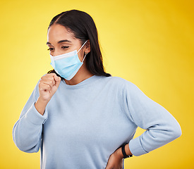 Image showing Covid, cough and sick with woman in studio for medical, virus and breathing problems. Illness, pandemic and healthcare with female and face mask on yellow background for disease, infection and flu