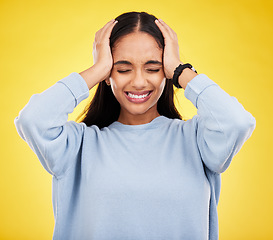 Image showing Stress, frustrated and woman with headache, pain and depression on a studio background. Female, lady and anxiety with migraine, tension and strain with injury, emergency and mind fatigue on backdrop