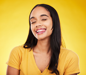 Image showing Funny, happy and woman with tongue out, silly and cheerful on studio background. Comic, female and lady with happiness, goofy and facial expression with joy, amusing and humor face with crazy gesture